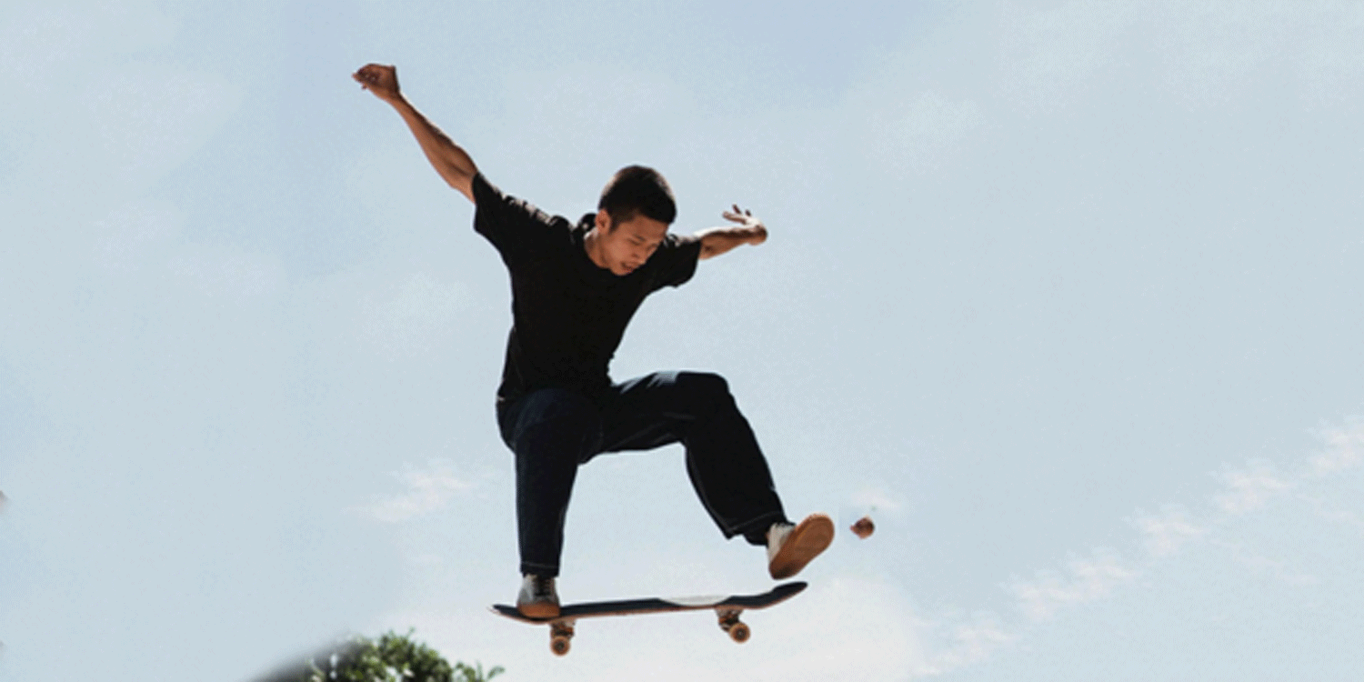 Skateboarder balancing in the air